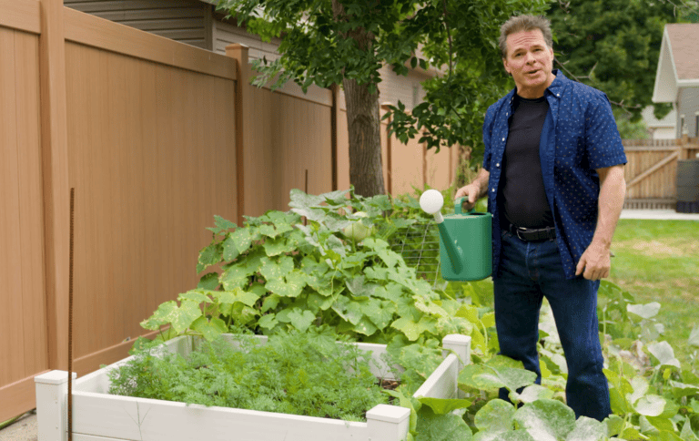 man watering garden